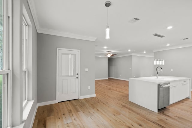 kitchen with decorative light fixtures, sink, ornamental molding, stainless steel dishwasher, and light hardwood / wood-style floors