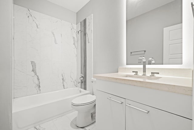 full bathroom featuring tiled shower / bath, vanity, and toilet