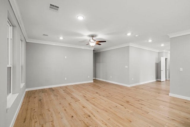 empty room with ceiling fan, ornamental molding, and light hardwood / wood-style floors