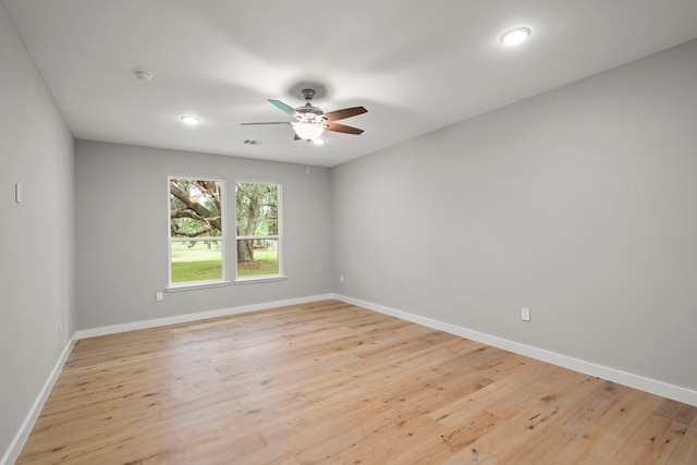 unfurnished room featuring ceiling fan and light wood-type flooring