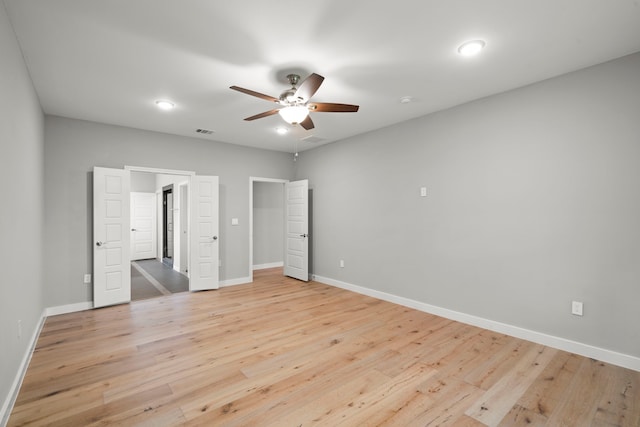 unfurnished bedroom featuring ceiling fan and light hardwood / wood-style floors