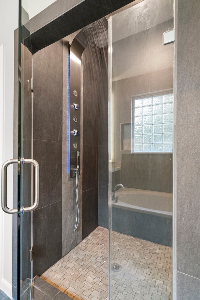 bathroom with a shower with shower door