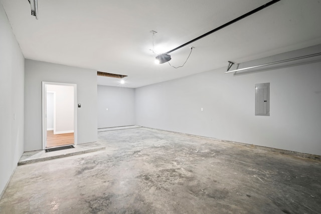 garage featuring a garage door opener and electric panel