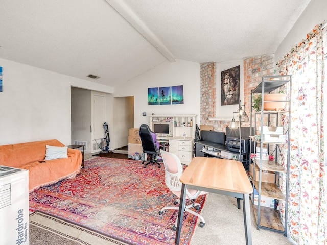 carpeted home office with lofted ceiling with beams and a textured ceiling