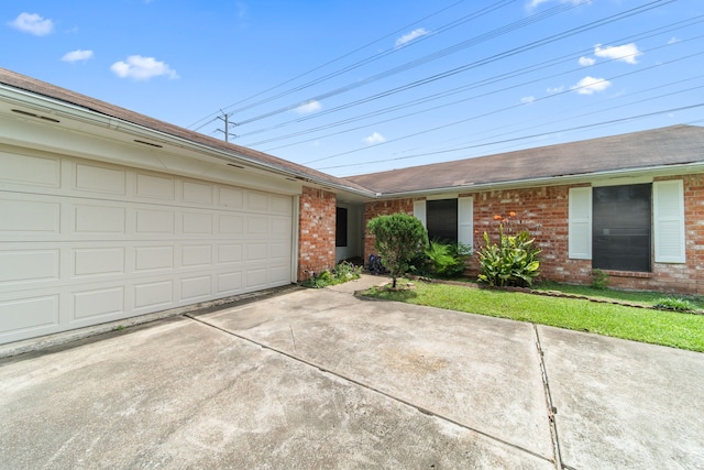 single story home featuring a garage