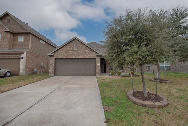 view of front of house featuring a garage and a front yard