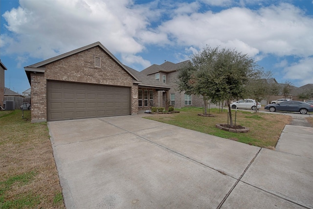 view of front facade featuring a garage and a front lawn