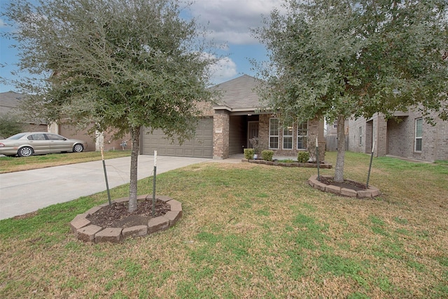 view of property hidden behind natural elements with a garage and a front yard