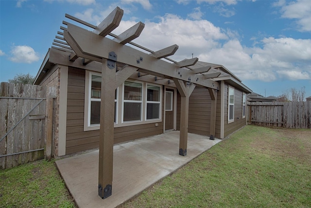 exterior space featuring a pergola, a lawn, and a patio area