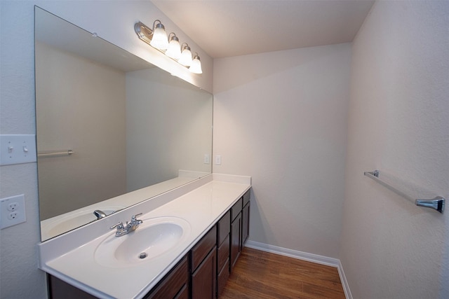 bathroom featuring vanity and wood-type flooring