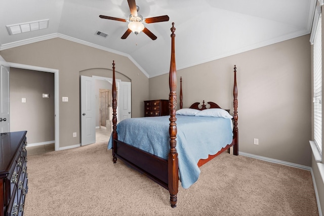 bedroom with vaulted ceiling, crown molding, light carpet, and ceiling fan