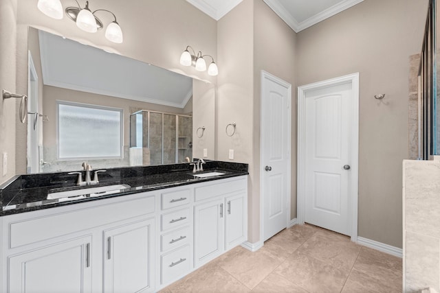 bathroom with ornamental molding, tile patterned flooring, a shower with door, and vanity