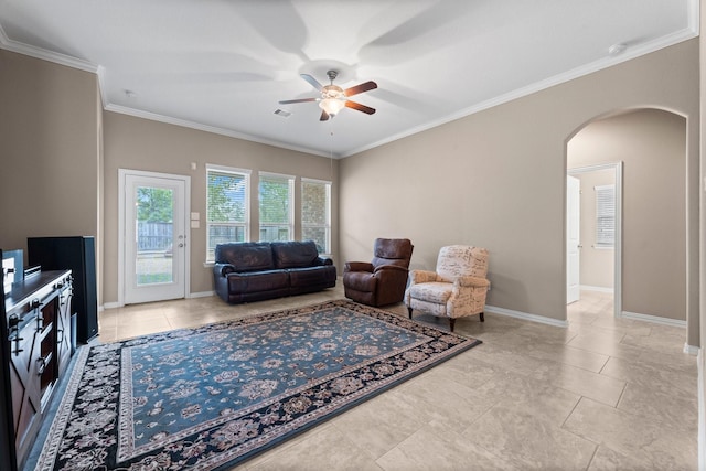 living room featuring crown molding and ceiling fan