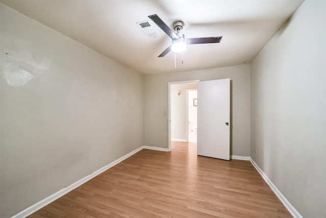 unfurnished room featuring ceiling fan and light wood-type flooring