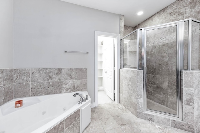 bathroom featuring shower with separate bathtub