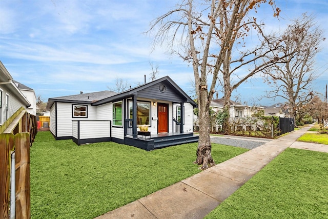 view of front of property with a front lawn