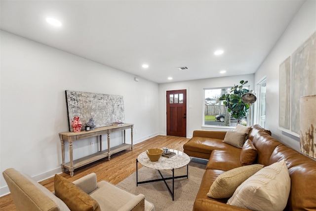 living room with light hardwood / wood-style floors