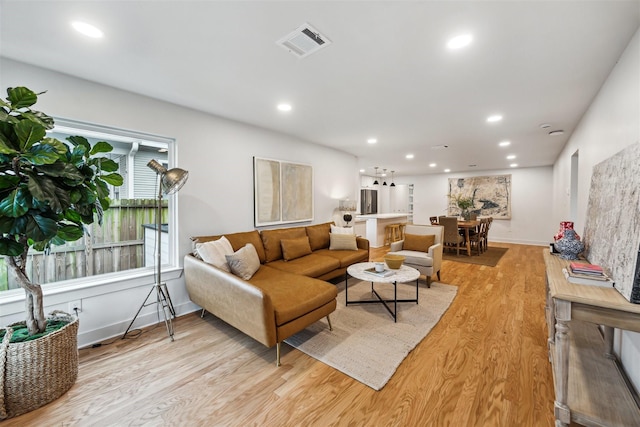 living room with light hardwood / wood-style flooring