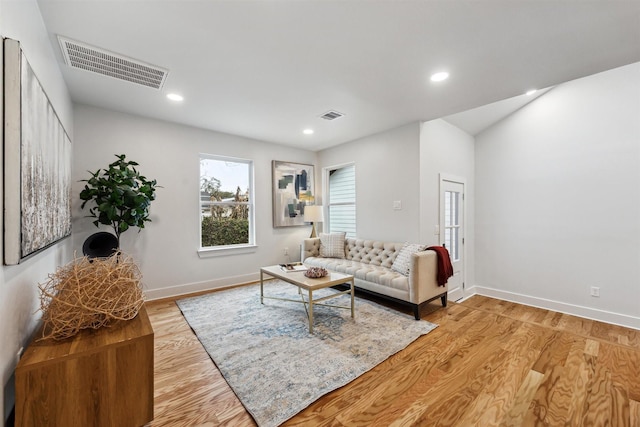 living room with light hardwood / wood-style floors