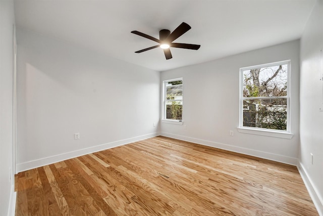 spare room with light hardwood / wood-style floors and ceiling fan