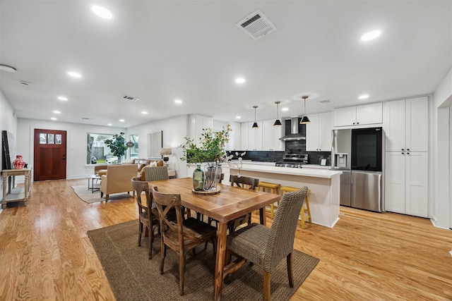 dining area with light wood-type flooring