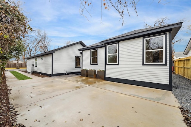 rear view of property featuring a patio