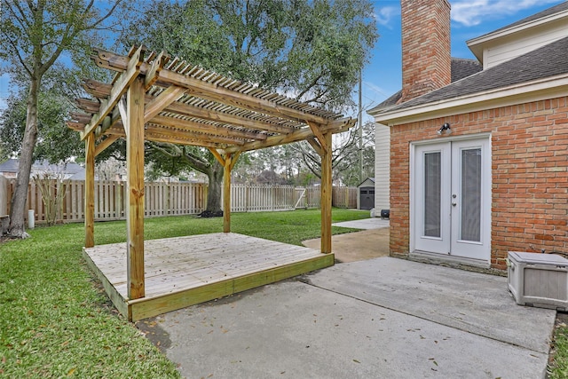 view of patio / terrace featuring a storage shed, a wooden deck, a pergola, and french doors