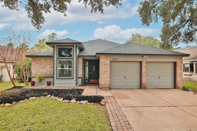 view of front facade with a garage and a front yard