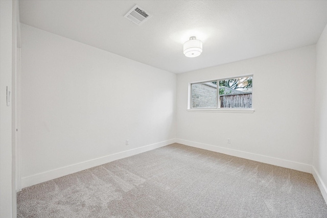 empty room with carpet flooring