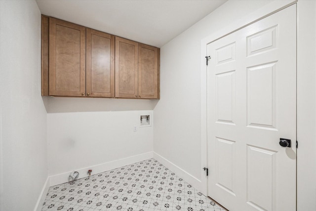 clothes washing area featuring cabinets, gas dryer hookup, and washer hookup