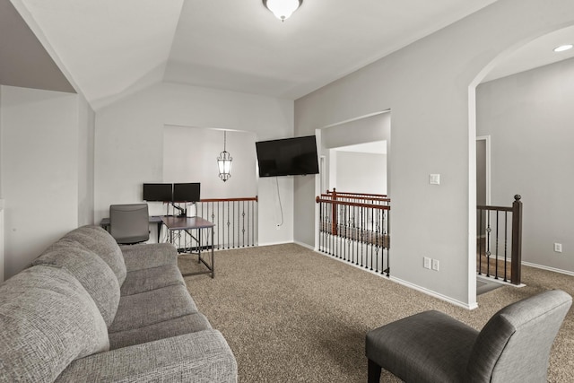 living room with vaulted ceiling and carpet flooring