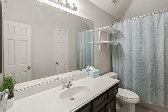 bathroom with vanity, vaulted ceiling, toilet, and a shower with shower curtain