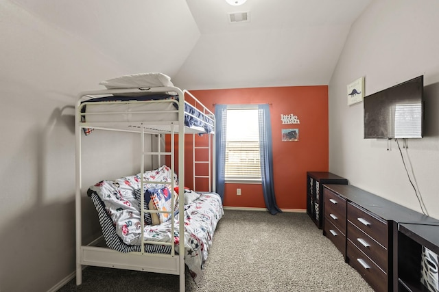 bedroom featuring lofted ceiling and carpet