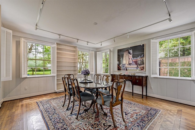 dining space featuring hardwood / wood-style flooring