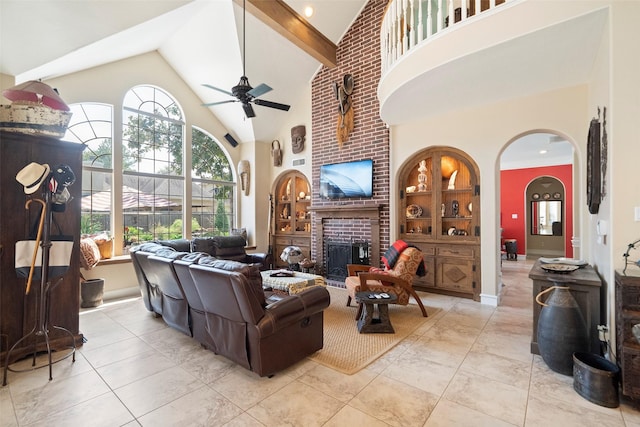 living room with light tile patterned floors, a fireplace, high vaulted ceiling, and ceiling fan