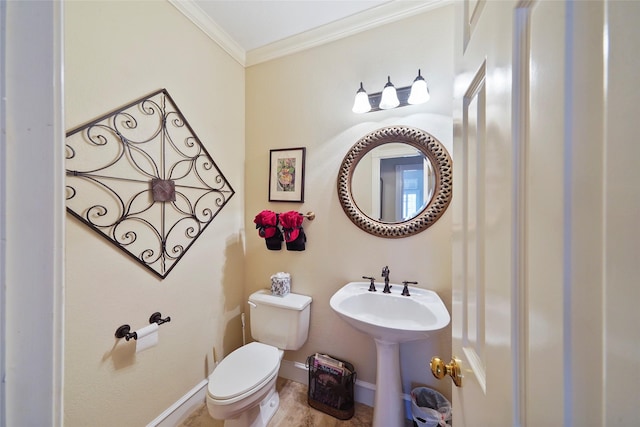 bathroom featuring crown molding and toilet