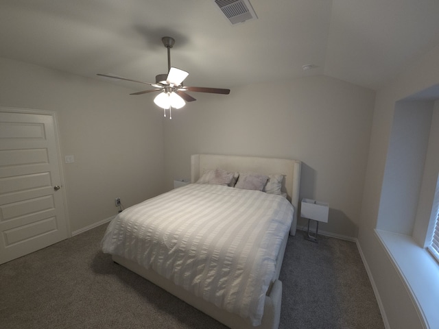 bedroom featuring lofted ceiling, dark carpet, and ceiling fan