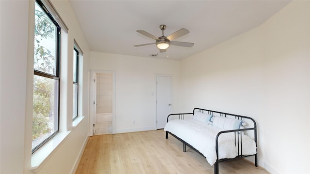 living area featuring ceiling fan and light hardwood / wood-style floors