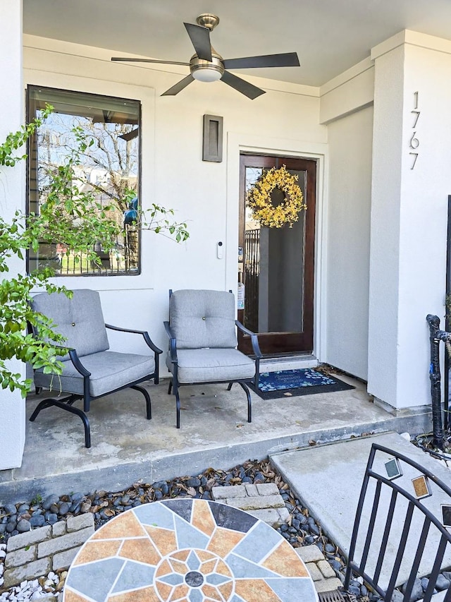 entrance to property with ceiling fan