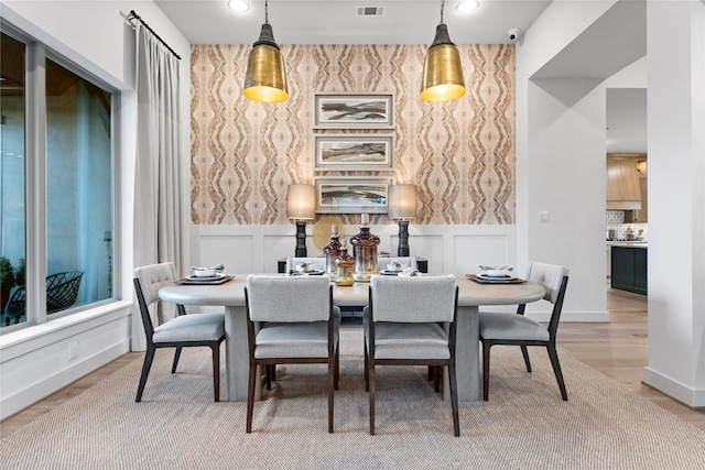 dining room with hardwood / wood-style flooring