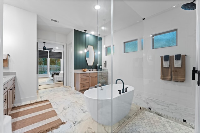 bathroom with vanity, shower with separate bathtub, and ceiling fan