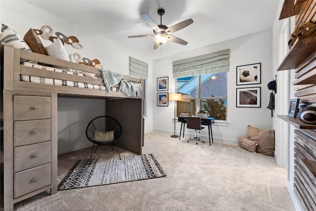 bedroom featuring light colored carpet and ceiling fan