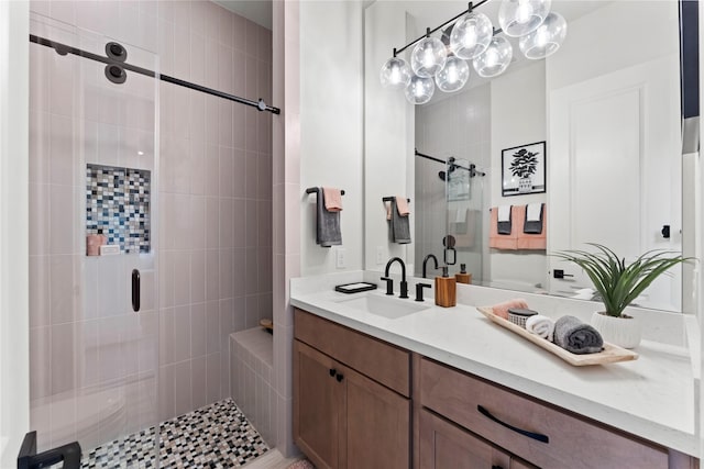 bathroom featuring vanity and an enclosed shower