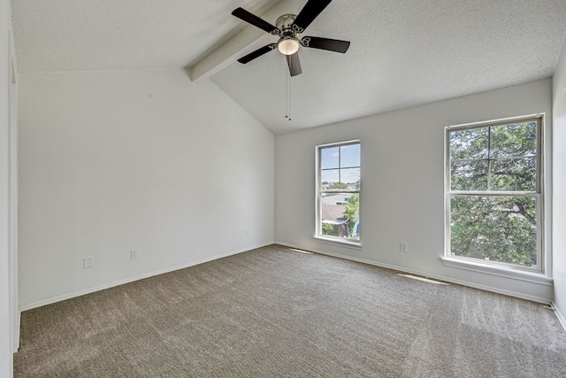 2022 Lakewood Ct, Willis, TX 77318 - carpeted spare room with lofted ceiling with beams, ceiling fan, a textured ceiling, and baseboards