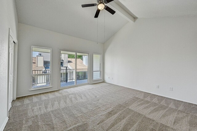 carpeted empty room featuring high vaulted ceiling, beamed ceiling, and a ceiling fan