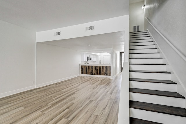 2022 Lakewood Ct, Willis, TX 77318 - stairway with visible vents and wood finished floors