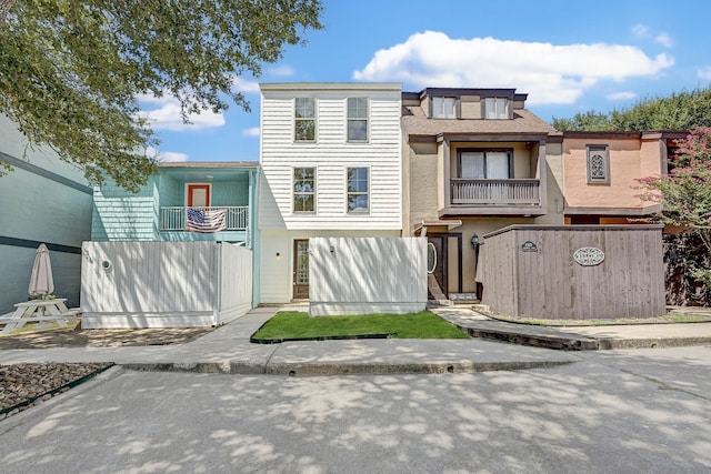 multi unit property featuring a balcony