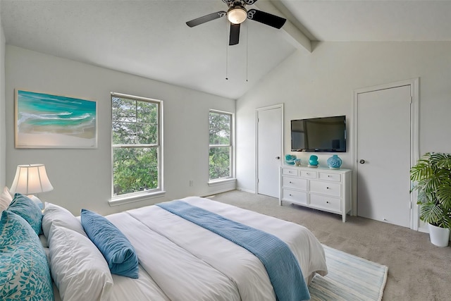 bedroom with a ceiling fan, light colored carpet, and vaulted ceiling with beams