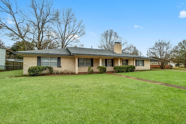 single story home with a front lawn