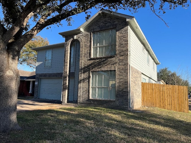 view of front of property with a garage and a front yard